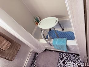 Denver apartment for rent - A backyard with a wooden fence and a green lawn.