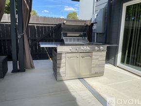 Fort Worth house for rent - A modern outdoor kitchen with a grill and sink.