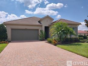 Bradenton house for rent - A house with a driveway in front of it.