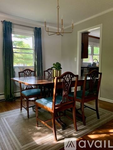 West Hartford apartment for rent - A dining room with a table and chairs.