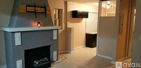 Melbourne house for rent - A fireplace with a black screen and a fire burning inside.