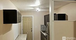 Melbourne house for rent - A kitchen area with a microwave, oven, and refrigerator.