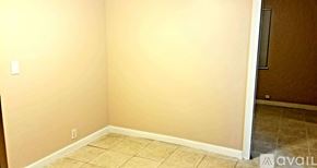 Melbourne house for rent - A room with beige walls and tiled flooring.