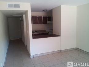 Phoenix apartment for rent - A kitchen area with white walls and a tiled floor.