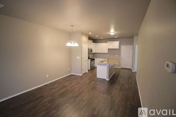 Yukon house for rent - A kitchen area with a white cabinet and a white countertop.