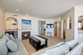 Oceanside apartment for rent - A dining room with a large table set for four.