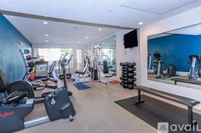 Lewisville apartment for rent - A gym with a variety of equipment including treadmills, weights, and exercise machines.