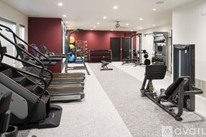Dallas apartment for rent - A gym with treadmills, weights, and exercise equipment.