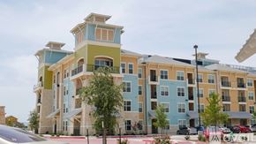 Little Elm apartment for rent - A modern apartment building with balconies and multiple stories.
