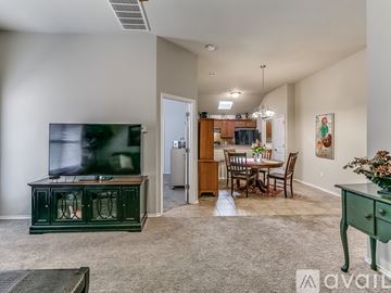 Edmond house for rent - A living room with a green cabinet and a television on the left side.