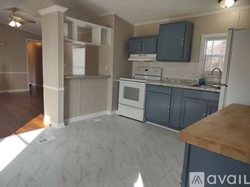 Rockford apartment for rent - A kitchen with a marble floor and a wooden counter top.