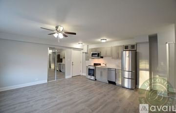 Chicago apartment for rent - A spacious kitchen with stainless steel appliances and a ceiling fan.
