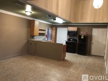 Ocala apartment for rent - A kitchen area with a counter and cabinets.
