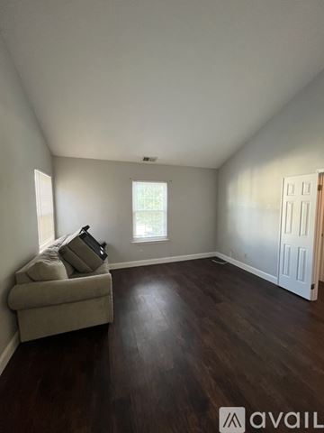 Mantua Township apartment for rent - A living room with a couch and a window.