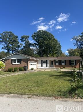 Carbondale house for rent - A house with a lawn in front of it.