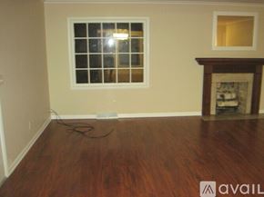 Carbondale house for rent - A room with a fireplace and a window.