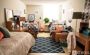 New Orleans house for rent - A bedroom with two beds, a desk, and a chair.