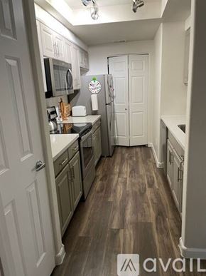 Scottsdale apartment for rent - A kitchen with wood flooring and white walls.