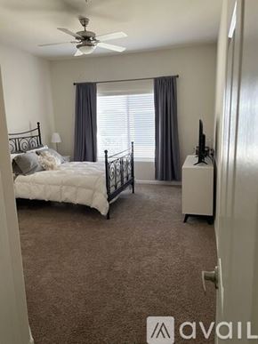 Scottsdale apartment for rent - A bedroom with a bed, dresser, and television.
