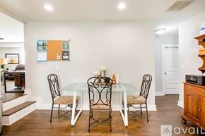 Atlanta house for rent - A dining room with a glass table and chairs.