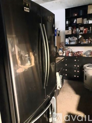 Marrero apartment for rent - A stainless steel refrigerator with its door open in a kitchen.