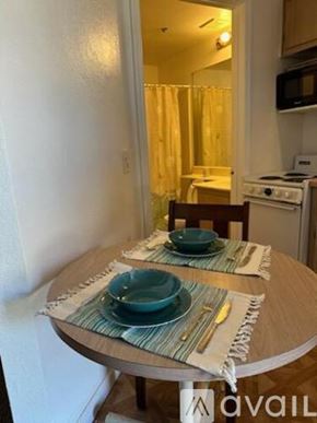 Bullhead City apartment for rent - A table with two plates on it in a kitchen.
