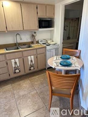 Bullhead City apartment for rent - A kitchen with a table and chairs.