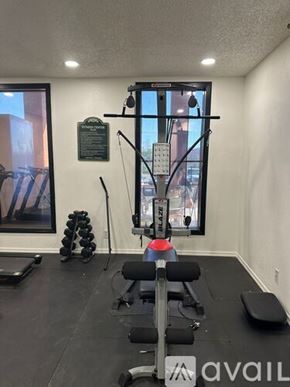 Bullhead City apartment for rent - A gym room with a row of dumbbells and a bench.