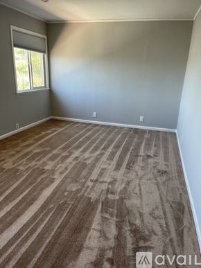 San Bruno apartment for rent - A room with a carpeted floor and a window.