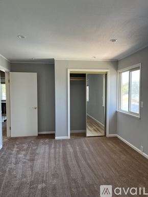 San Bruno apartment for rent - A room with a carpeted floor and a window.