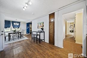 Tulsa house for rent - A dining room with a table and chairs is available for rent.