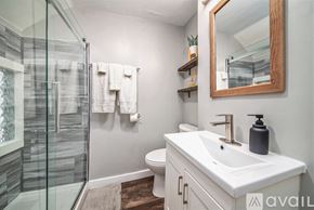 Grand Rapids apartment for rent - A bathroom with a white sink and a mirror.