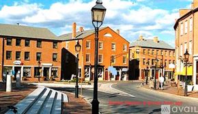 Newburyport apartment for rent - A street view of a town with buildings and a street light.