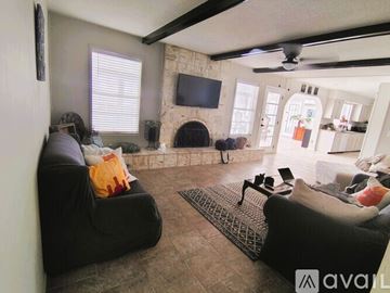 El Paso house for rent - A kitchen with green cabinets and a marble countertop.