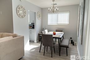 Fullerton house for rent - A dining room with a table, chairs, and a chandelier.