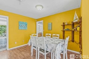 Ormond Beach house for rent - A dining room with a table set for six.