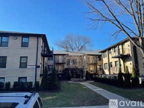Highland Park apartment for rent - A building with a car parked in front of it.