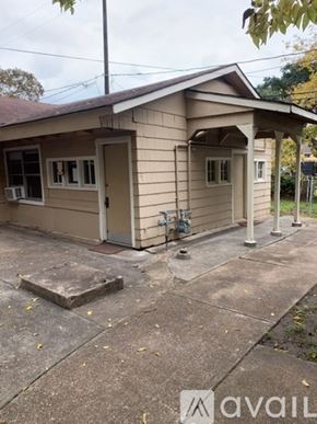 Houston apartment for rent - A small building with a porch and a door is shown.