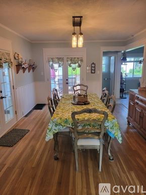 St. Joseph house for rent - A dining room with a table set for four.