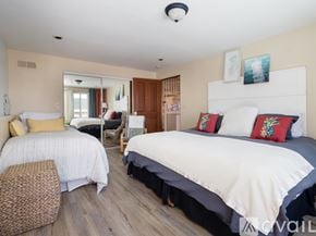 El Segundo apartment for rent - A bedroom with two beds and a chair.
