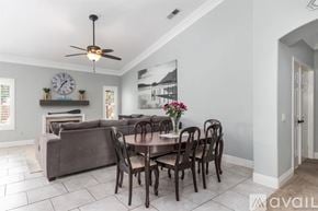 Oceanside house for rent - A dining room with a table set for six.