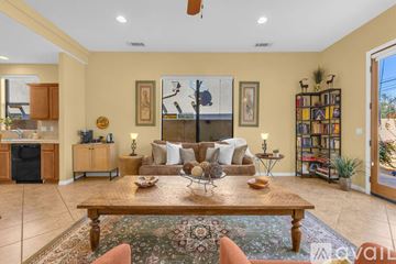 La Quinta apartment for rent - A living room with a brown sofa and a wooden coffee table.