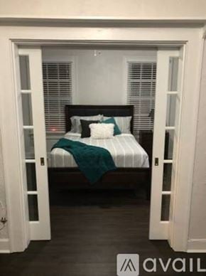 Tampa apartment for rent - A bedroom with a bed and a window.