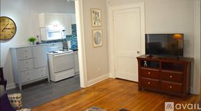 Tampa apartment for rent - A kitchen with a microwave, oven, and drawers.