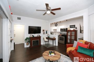 Tampa apartment for rent - A living room with a red couch and a coffee table.