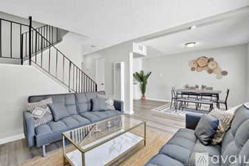 Indio apartment for rent - A living room with a grey sofa and a glass coffee table.