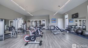 Powell apartment for rent - A gym with a variety of equipment including treadmills, weights, and exercise balls.