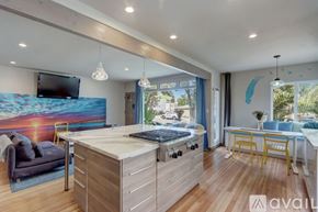 San Diego house for rent - A modern kitchen with wooden cabinets and a large island.