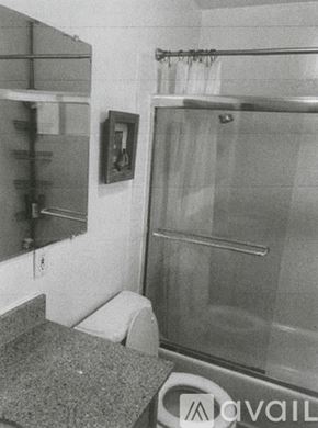 Lake Forest house for rent - A bathroom with a toilet, sink, and shower.