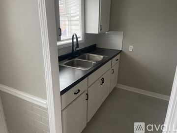 Hammond apartment for rent - A kitchen with a sink and cabinets.